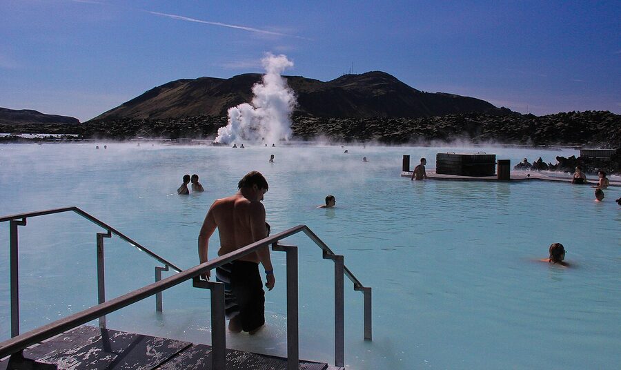 Misty Blue Lagoon with bathers in the distance