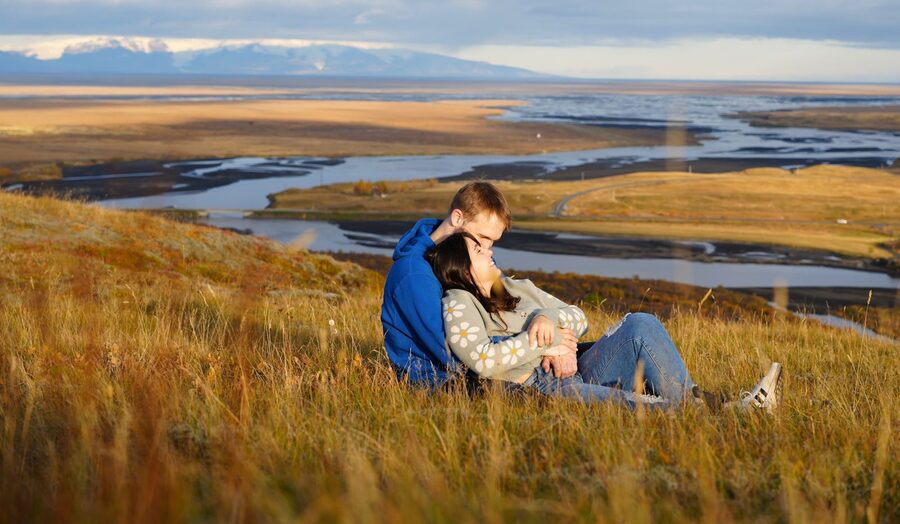 Family at a viewpoint above an Icelandic river valley