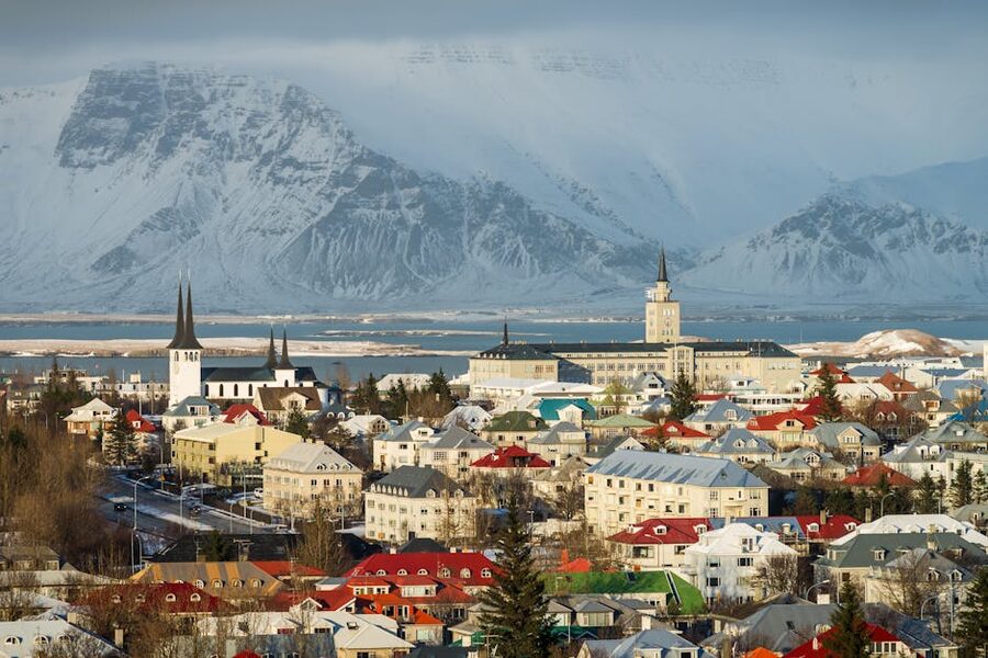 Aerial view of Reykjavik with snow capped mountains in winter