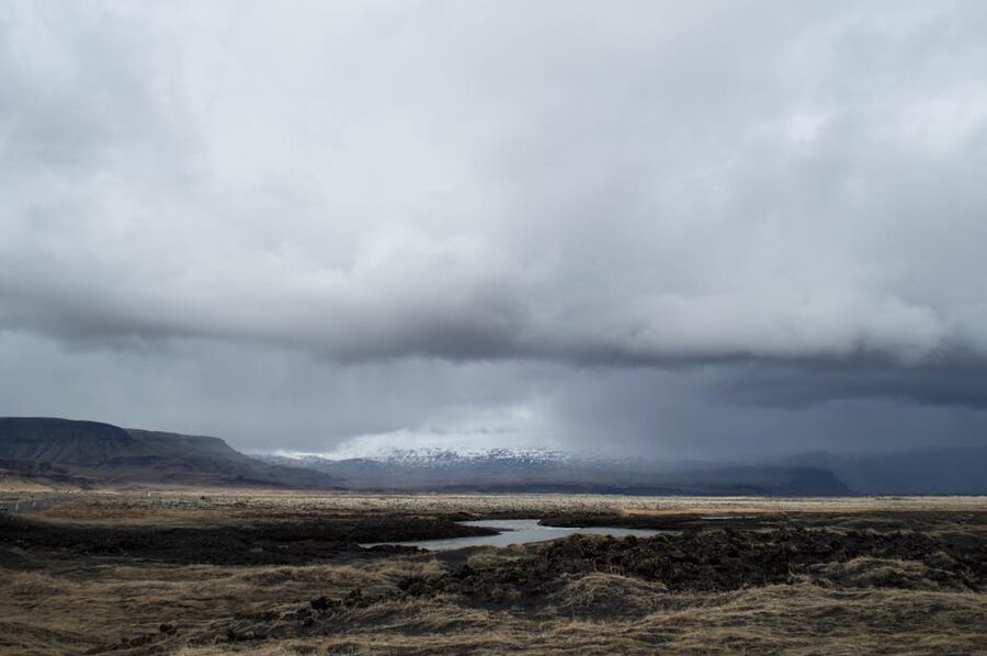 Storm clouds over Icelandic mountains with snow on the peaks