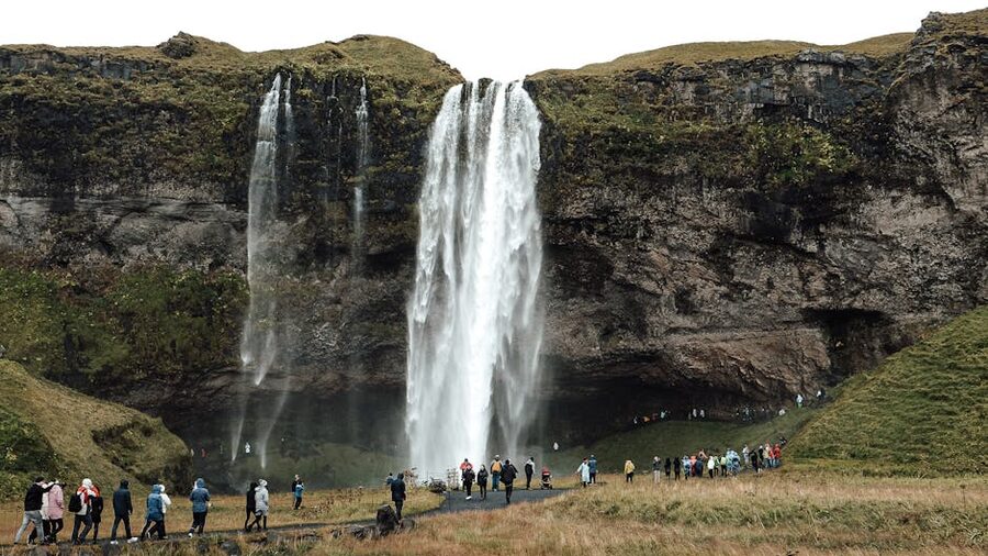 Tourists at Seljalandsfoss waterfall