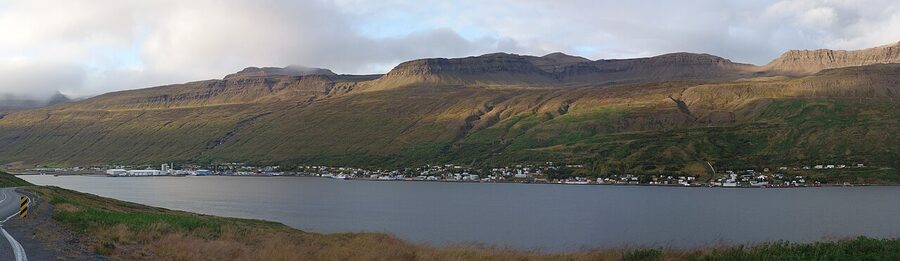 Panorama of Eskifjordur fishing village with mountains behind