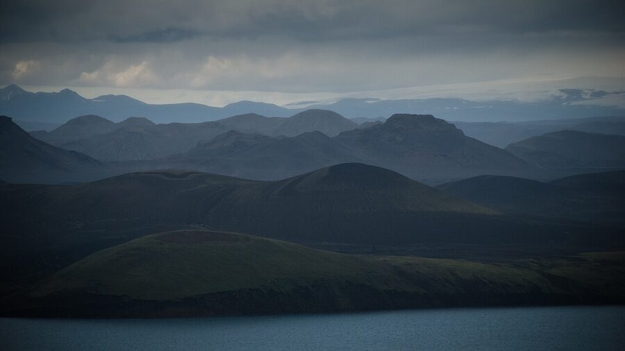 Dark moody Icelandic landscape with mountains and low evening light