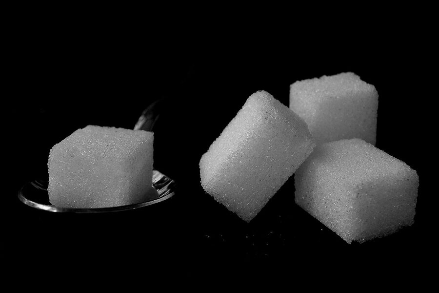 Sugar cubes on a black background, an oblique reference to the Sugarcubes band