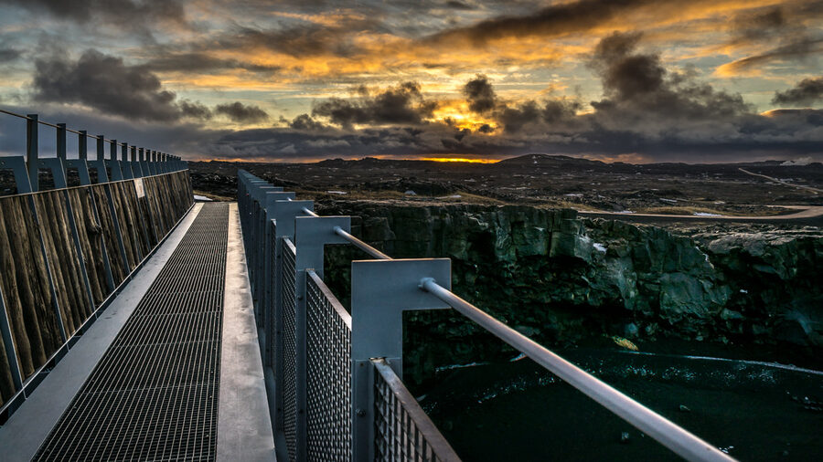 The Bridge Between Two Continents footbridge across a small rift on the Reykjanes peninsula, Iceland