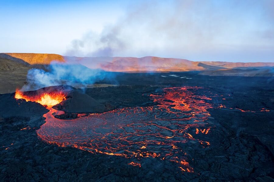 Aerial view of Reykjanes lava eruption flowing across dark terrain near Grindavik