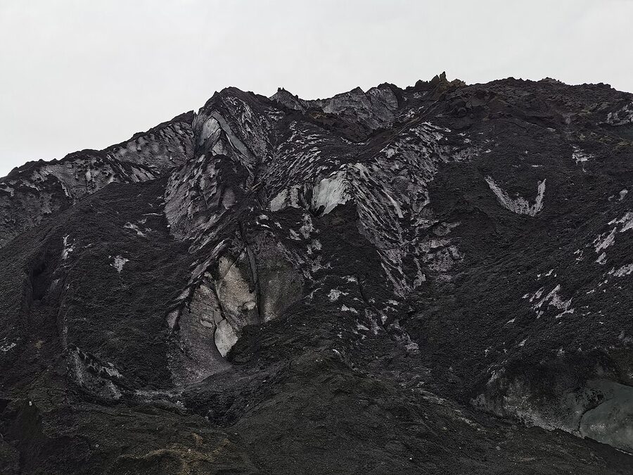 The Solheimajokull outlet glacier in southern Iceland, with visible blue ice and ash layers