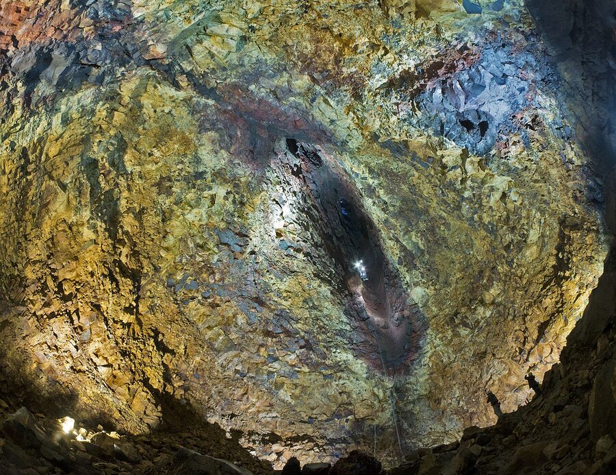 Inside the Thrihnukagigur magma chamber, Iceland, visitors descending in a basket