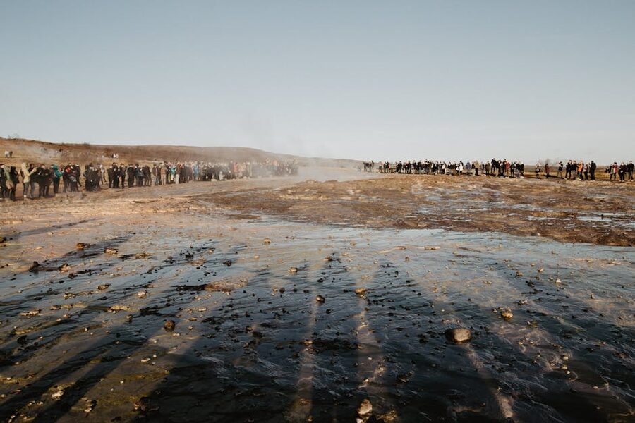 Tourists watching geyser field at Haukadalur