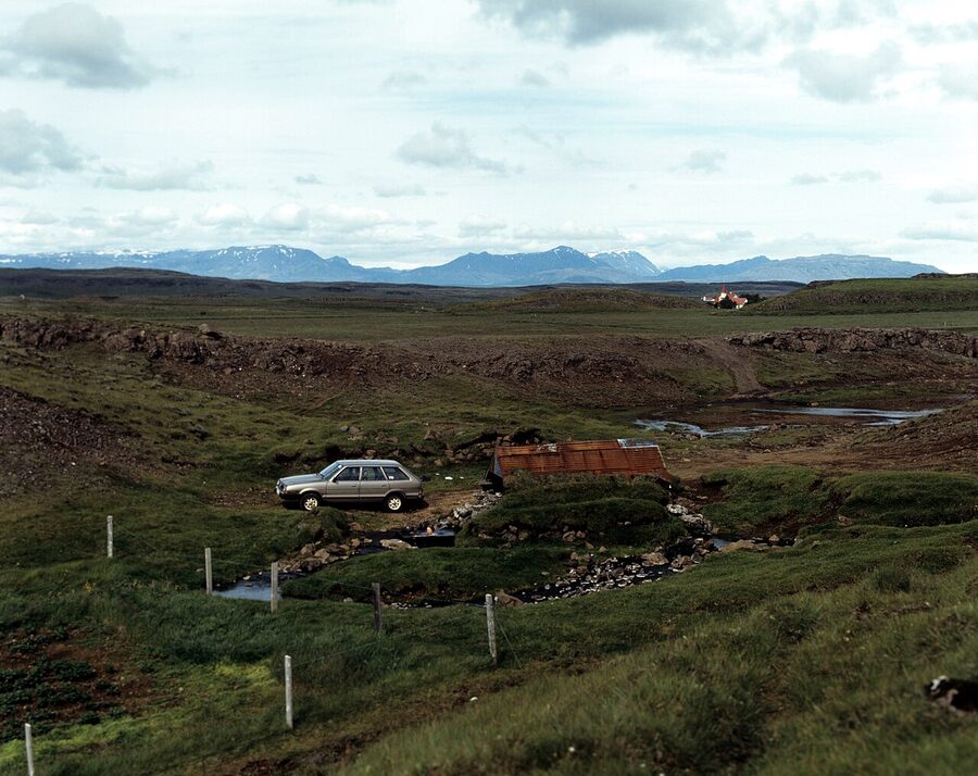 The tiny stone Hrunalaug hot spring on a sheep farm near Fludir