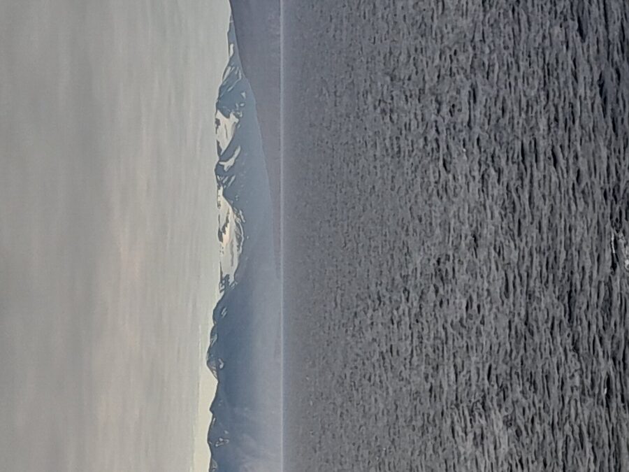 Passengers on the deck of a whale watching boat off Husavik