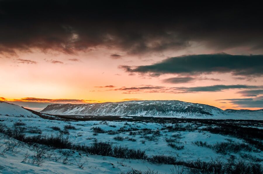 Snowy Icelandic landscape under dramatic clouds