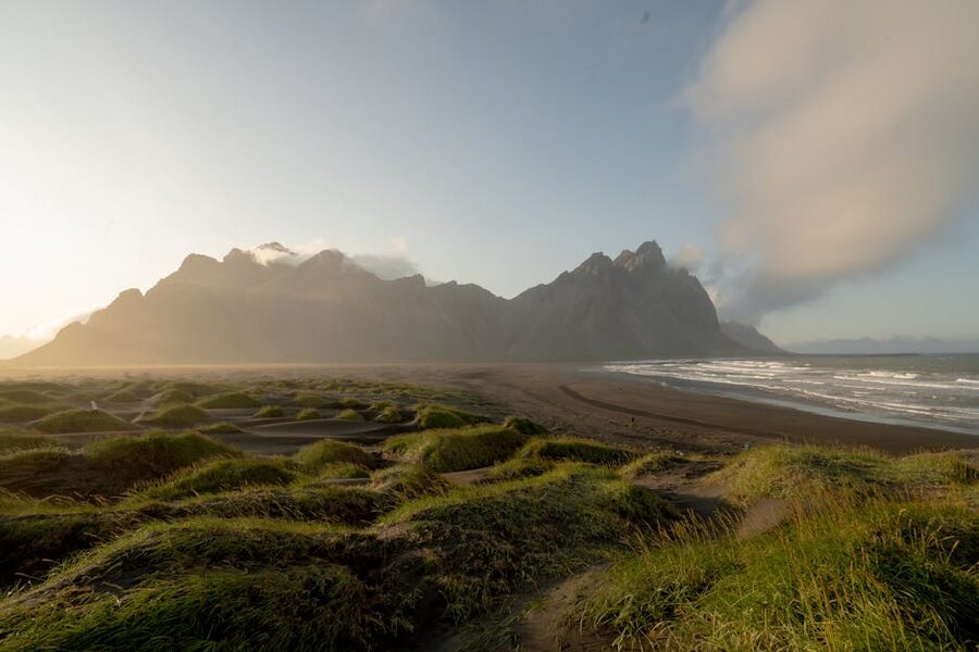 Vestrahorn mountain with black sand dunes and ocean at Stokksnes