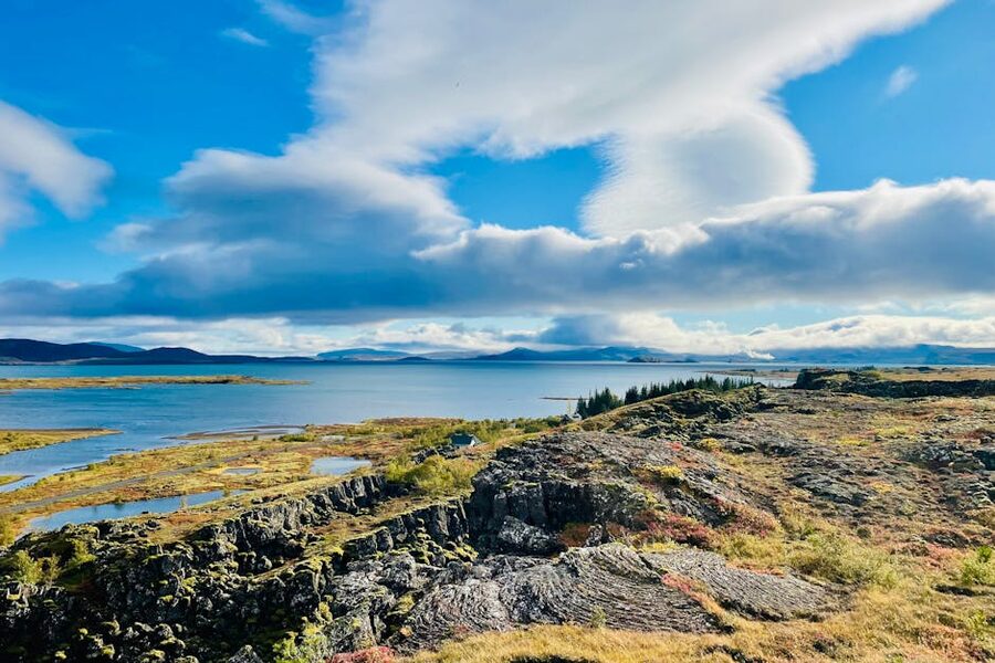 Thingvellir National Park cliffs and lake under cloudy sky