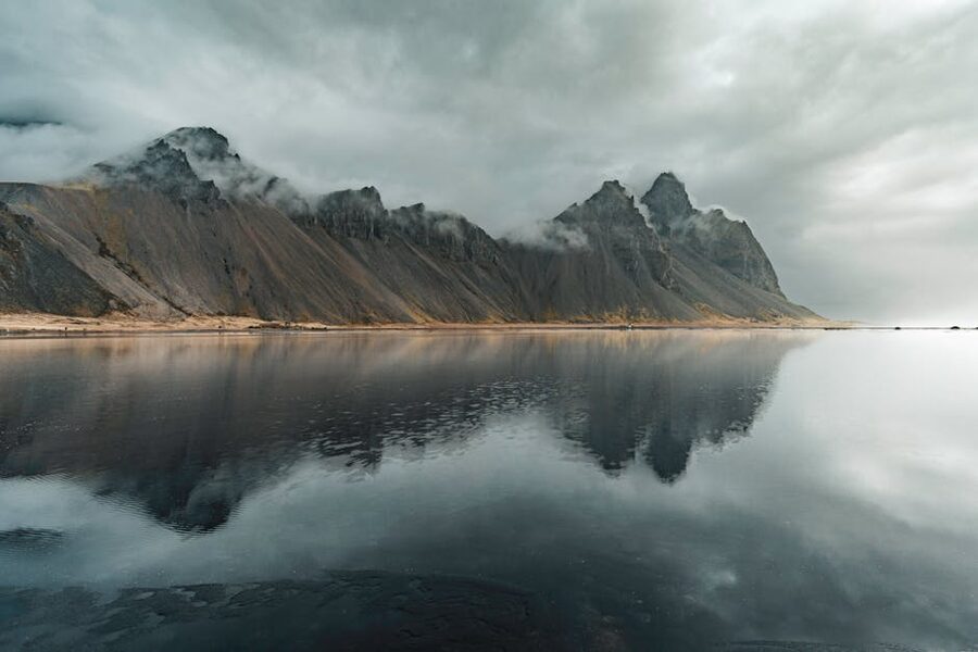 Vestrahorn mountain reflected in calm waters at Stokksnes
