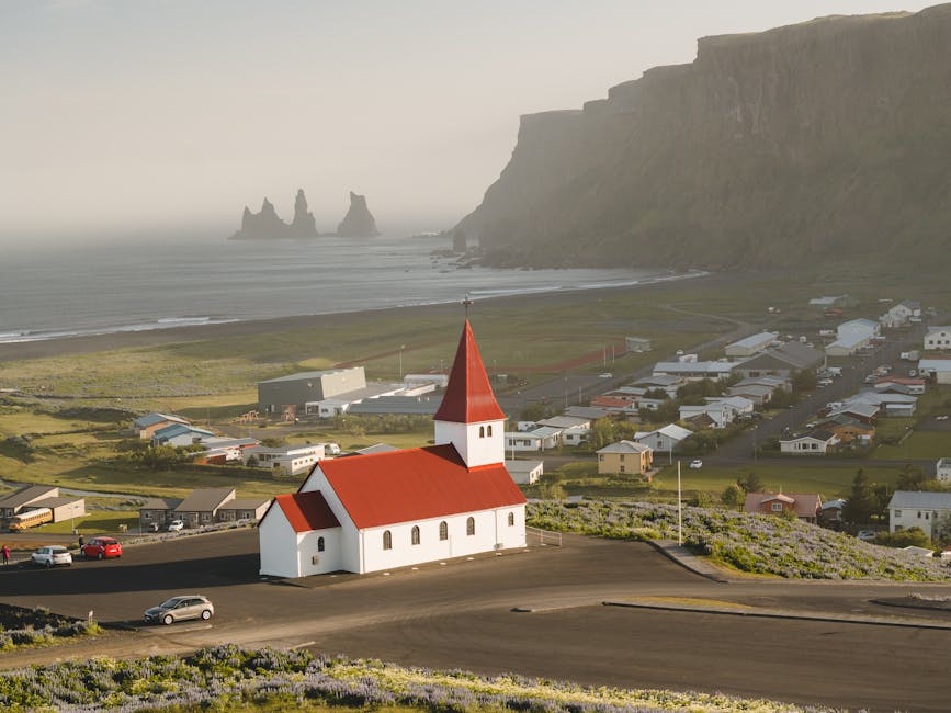 Aerial view of Vik church and Reynisdrangar sea stacks