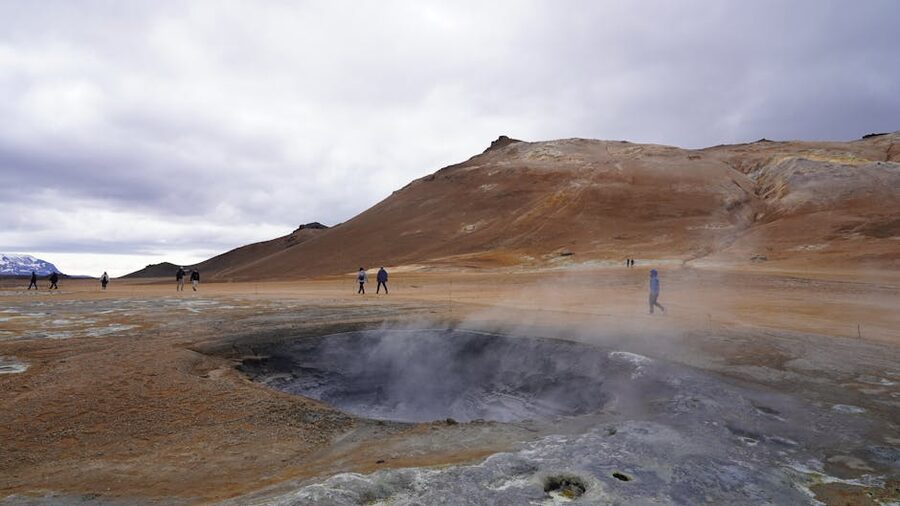 Steaming geothermal valley in Iceland with a small footpath