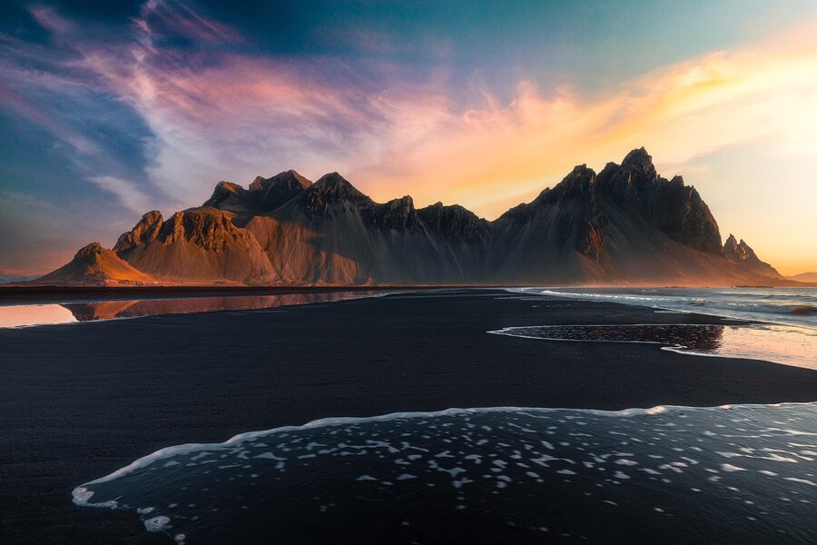 Vestrahorn mountain at Stokksnes with black volcanic sand at sunset