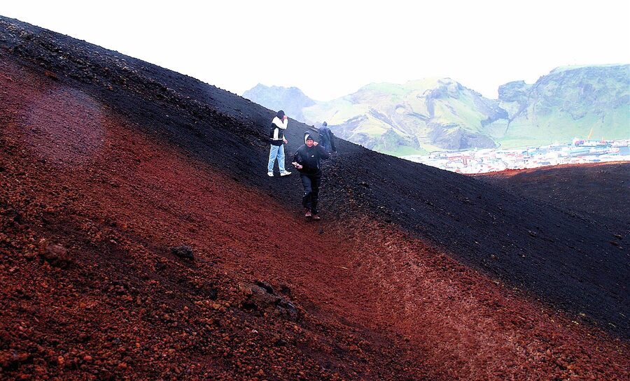 Hikers climbing Eldfell volcano