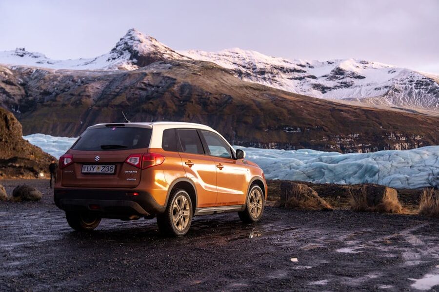 Orange SUV near a glacier in Iceland