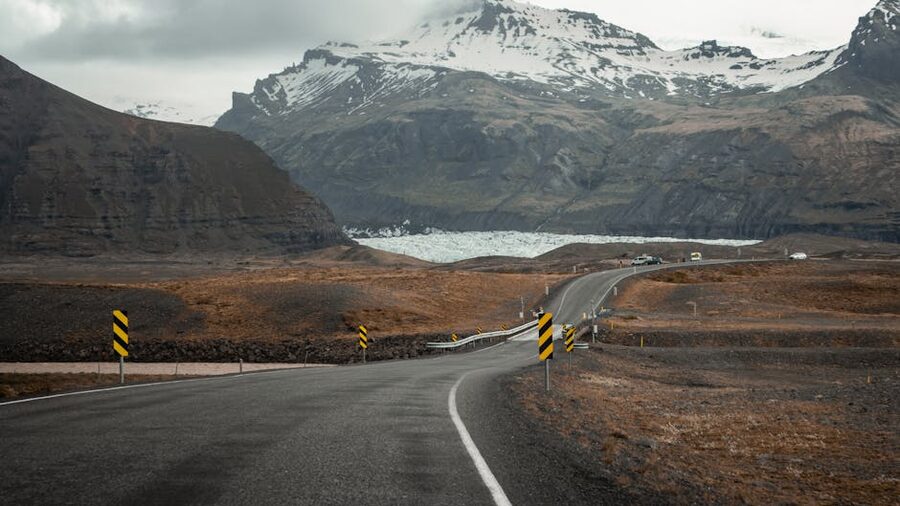 Road through Vik i Myrdal with mountain backdrop in Iceland