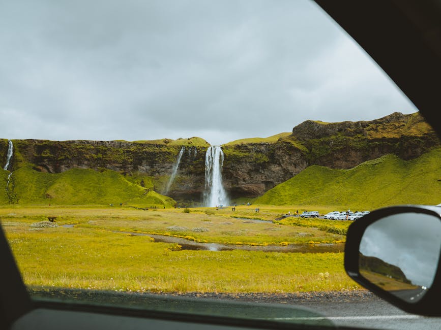 Seljalandsfoss waterfall seen through a car window in Iceland