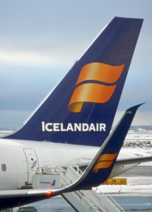 Icelandair tail livery in Reykjavik with mountains in the background