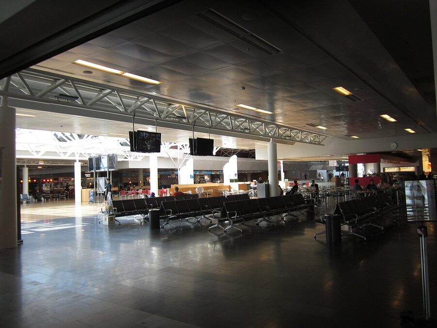 Keflavik Airport waiting room with passengers and large windows