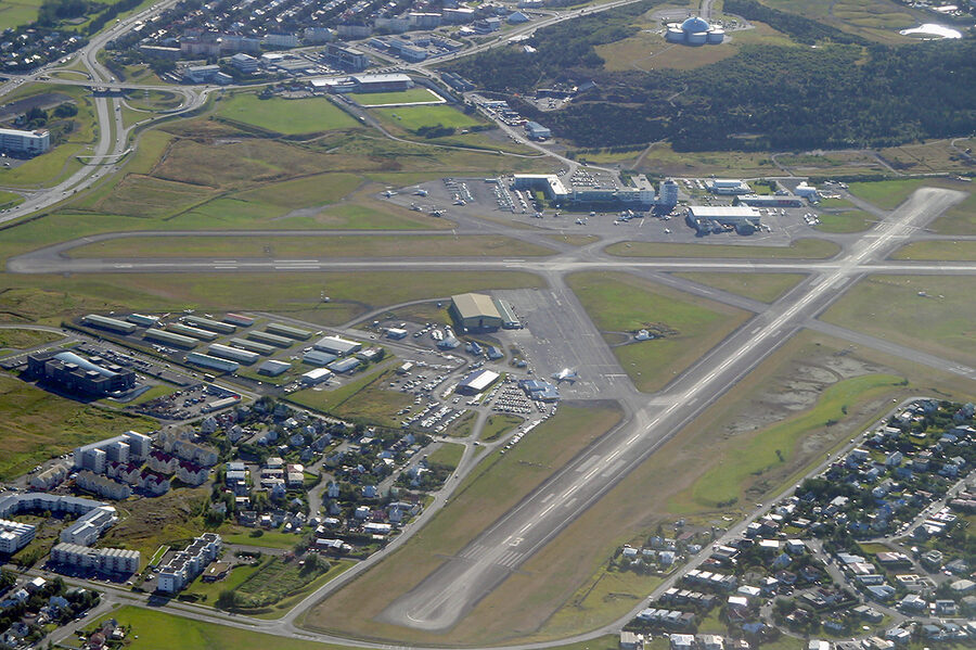 Reykjavik domestic airport aerial view from above showing runways and the city