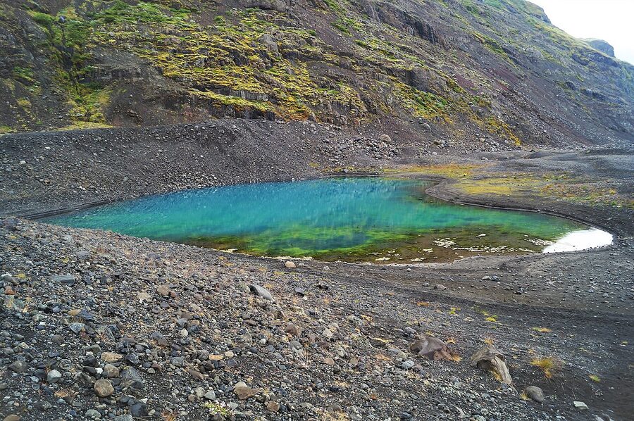 Blue and green meltwater lake at the bottom of Skaftafellsjokull glacier Iceland