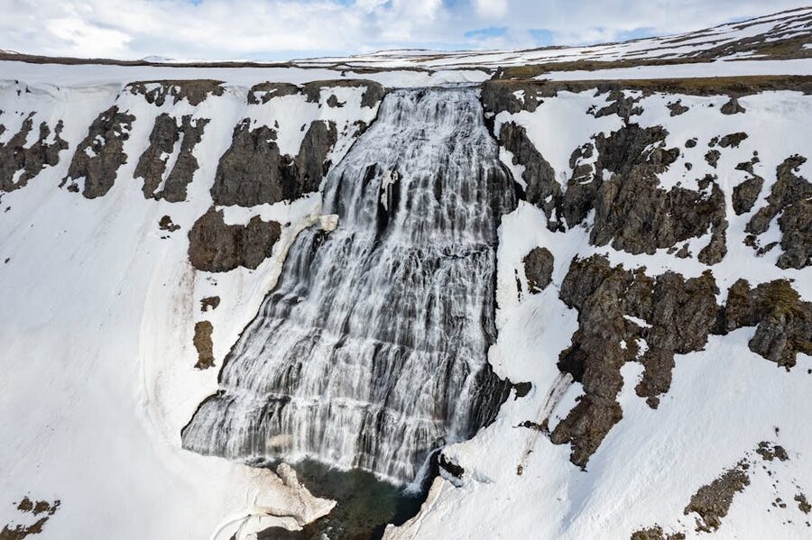 Dynjandi waterfall cascading down stepped cliffs in the Westfjords