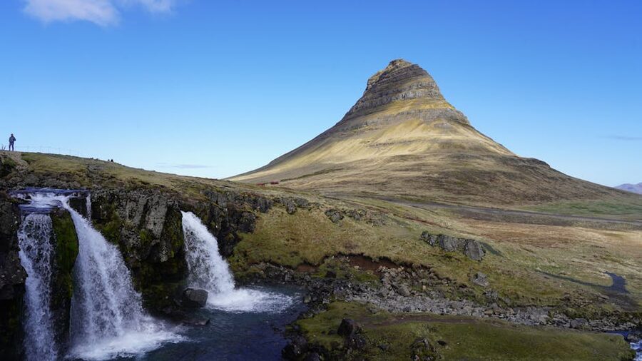Kirkjufell mountain on the Snaefellsnes peninsula with a small waterfall in the foreground