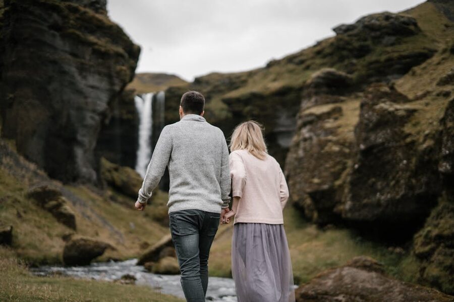Couple at an Icelandic waterfall