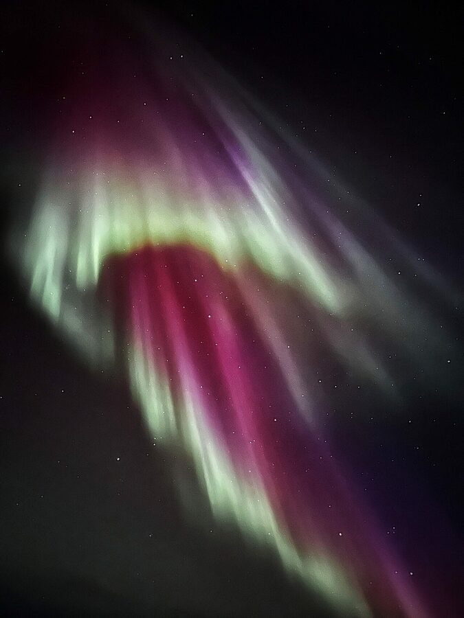 Green Northern Lights aurora over Iceland in winter