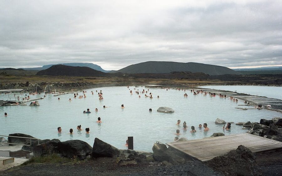 People relaxing in the milky-blue water of the Blue Lagoon in Reykjanes