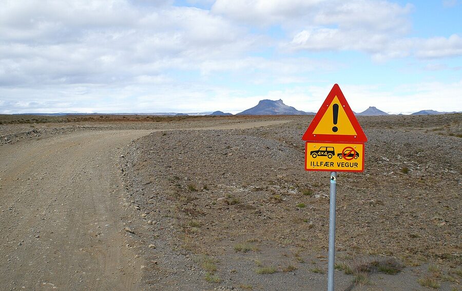 Display of Icelandic road signs showing speed limits and warnings