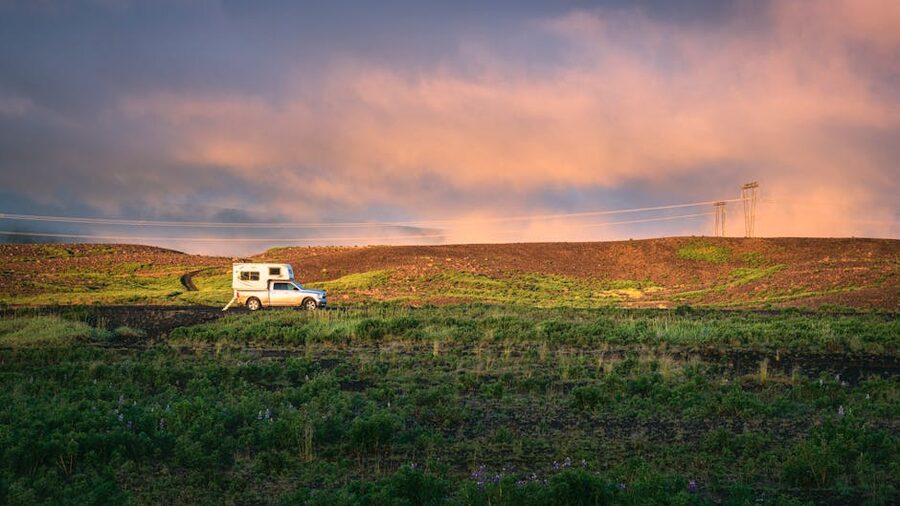 A campervan in the Icelandic countryside at sunset