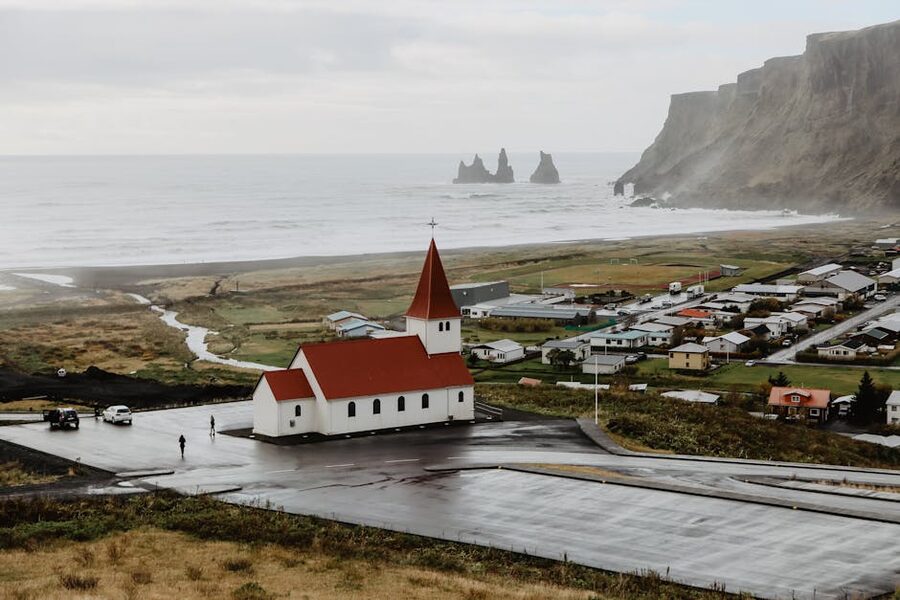 Vik i Myrdal Church above the cliffs and ocean