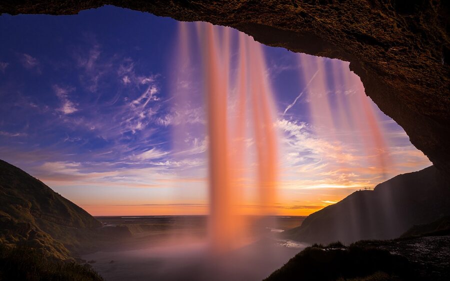 Iceland summer sunset with golden light over coastal landscape