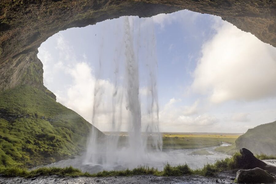 View from behind the curtain of water at Seljalandsfoss waterfall