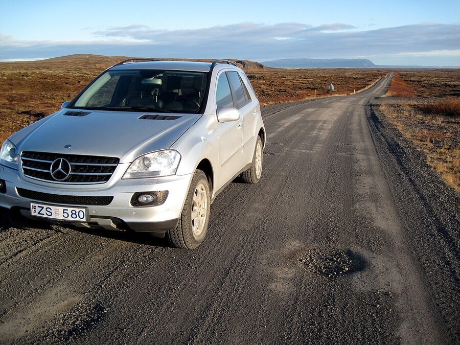 SUV driving on Road 427 along Iceland south coast