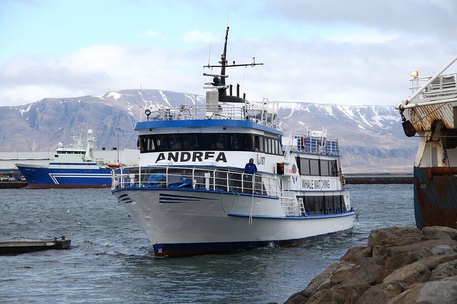 Whale watching catamaran boat near Reykjavik harbour Iceland