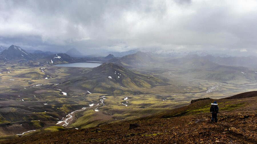 Young traveller at an Icelandic fjord viewpoint