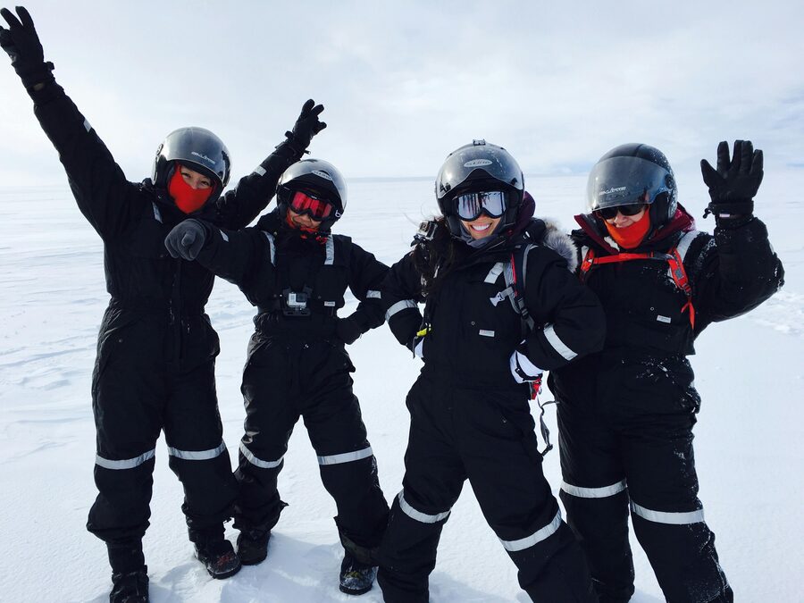 Snowmobiles crossing the white expanse of Langjokull glacier