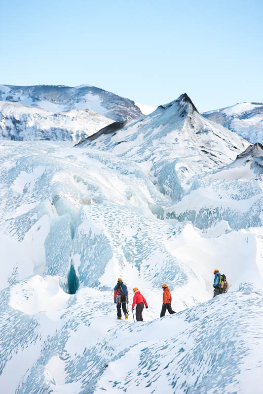 Hikers on the blue ice of Vatnajokull glacier in Skaftafell