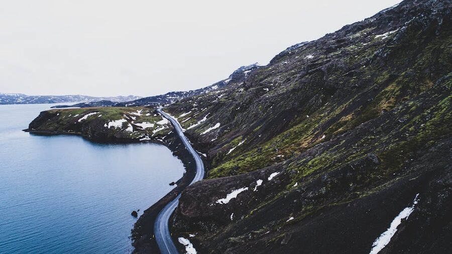Aerial view of a winding coastal road along Iceland south coast