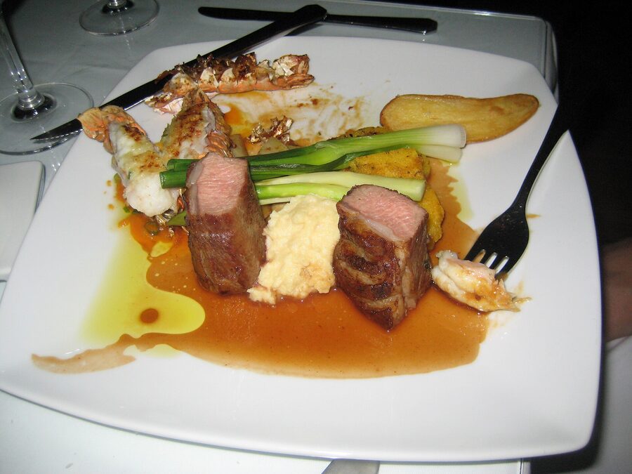 Grilled lamb steak with Icelandic langoustine tails polenta rosemary and plum sauce