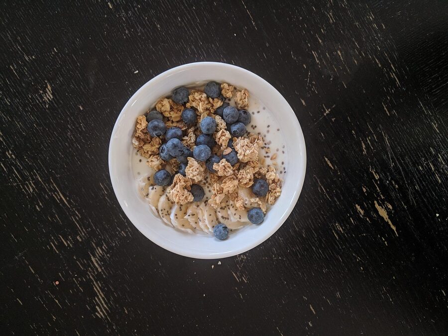 Skyr with blueberries in a dark bowl