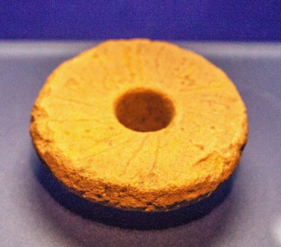 Spindle whorl carved with runic inscription