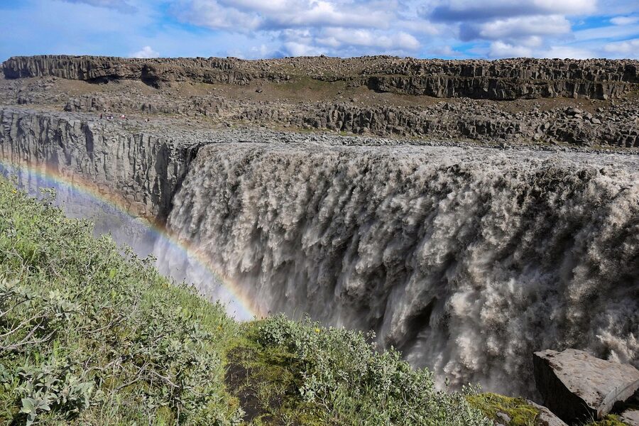 A rainbow at Dettifoss waterfall in summer, Iceland